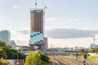 The picture shows the first floor of the EDGE East Side Tower at Warschauer Strasse station in Berlin during sunrise.