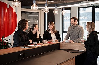 Civil engineers have a sociable exchange about their career ambitions.