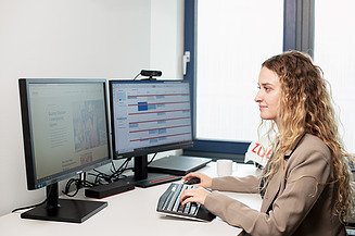 A young professional works at her desk.