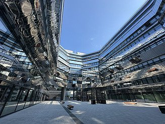 The inner courtyard of the Althan Quartier with its impressive stainless steel façade.